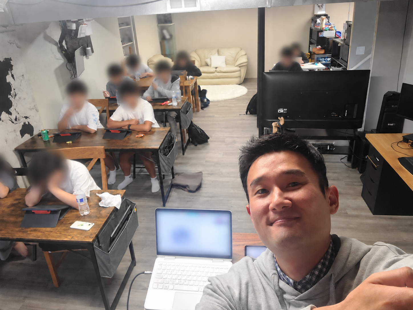 Eric with students in the Michigan classroom in September 2024; student faces and identifying details are blurred