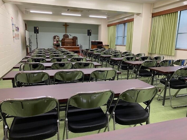 The second-floor hall at Okinawa Korean Church, with rows of desks and chairs